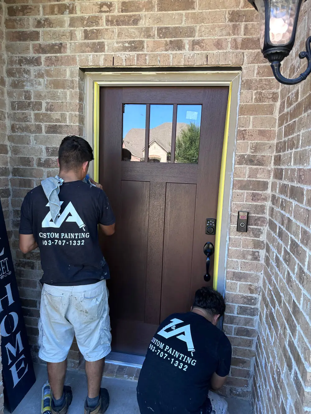 Z&A Custom Painting team painting exterior door