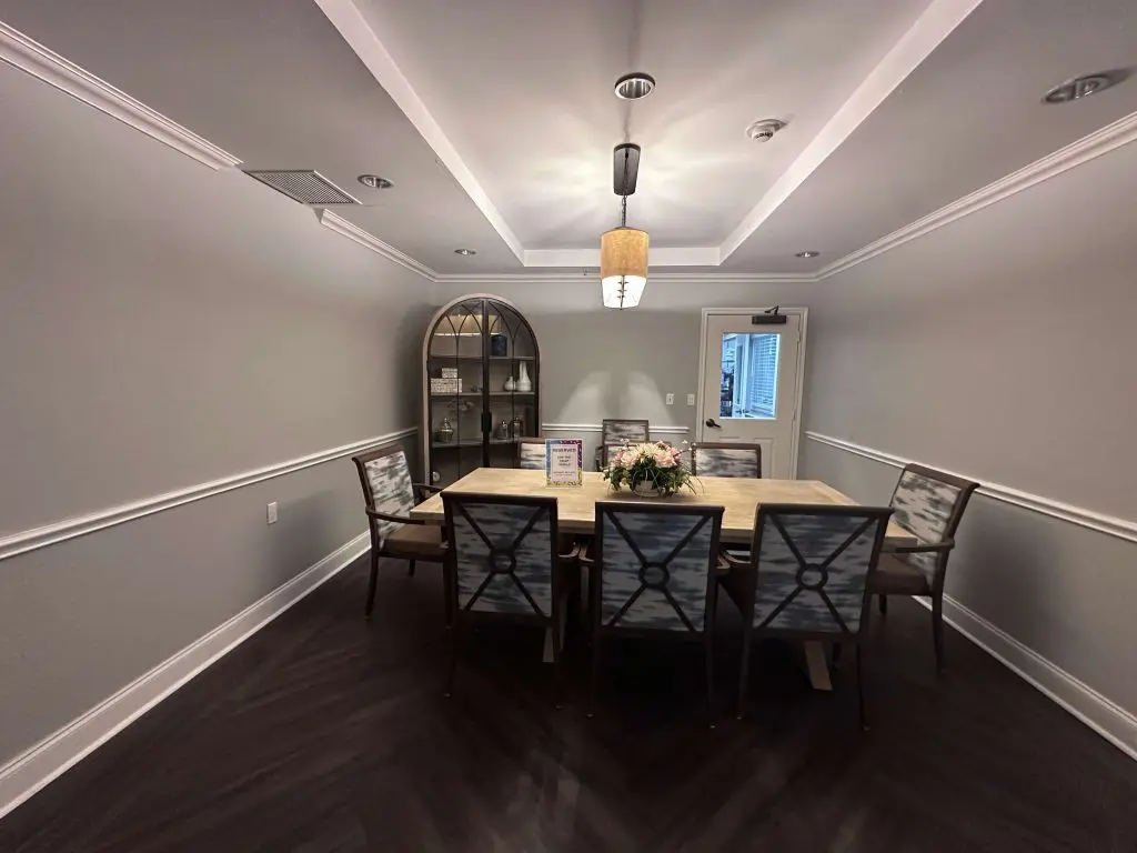 Commercial Painters in Tyler, TX painting highlighting precision trim work and ceiling detail in a formal dining or meeting room.