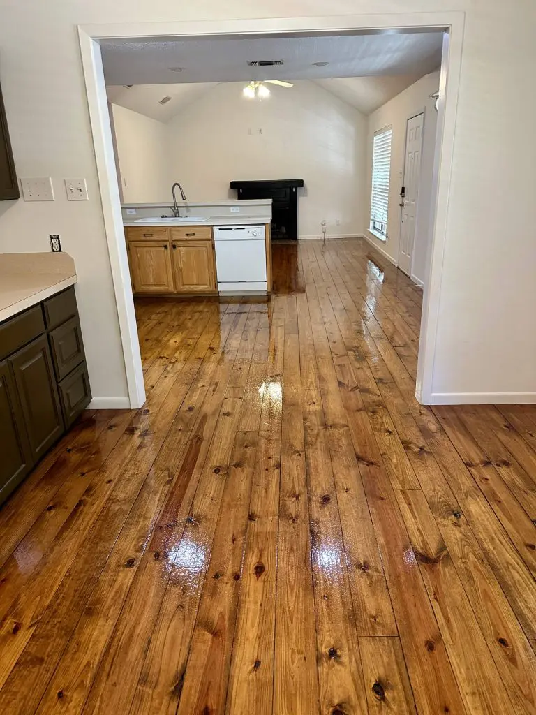 Interior painting and cabinet refinishing project showing clean vaulted walls and contrasting kitchen cabinets by Z&A Custom Painting in East Texas.