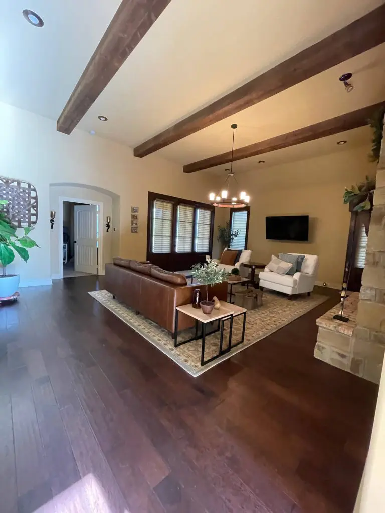 Luxury living room interior painting and custom stained wood beam project completed by Z&A Custom Painting in a high-end East Texas home.